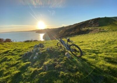 Electric mountain bike and sunset on coast