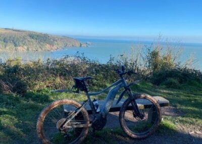E mountain bike with blue sea in background