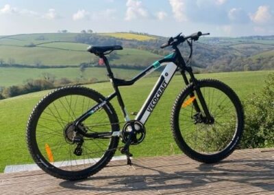 E Mountain bike and green fields in background