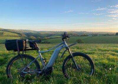 E mountain bike in valley with back box fitted